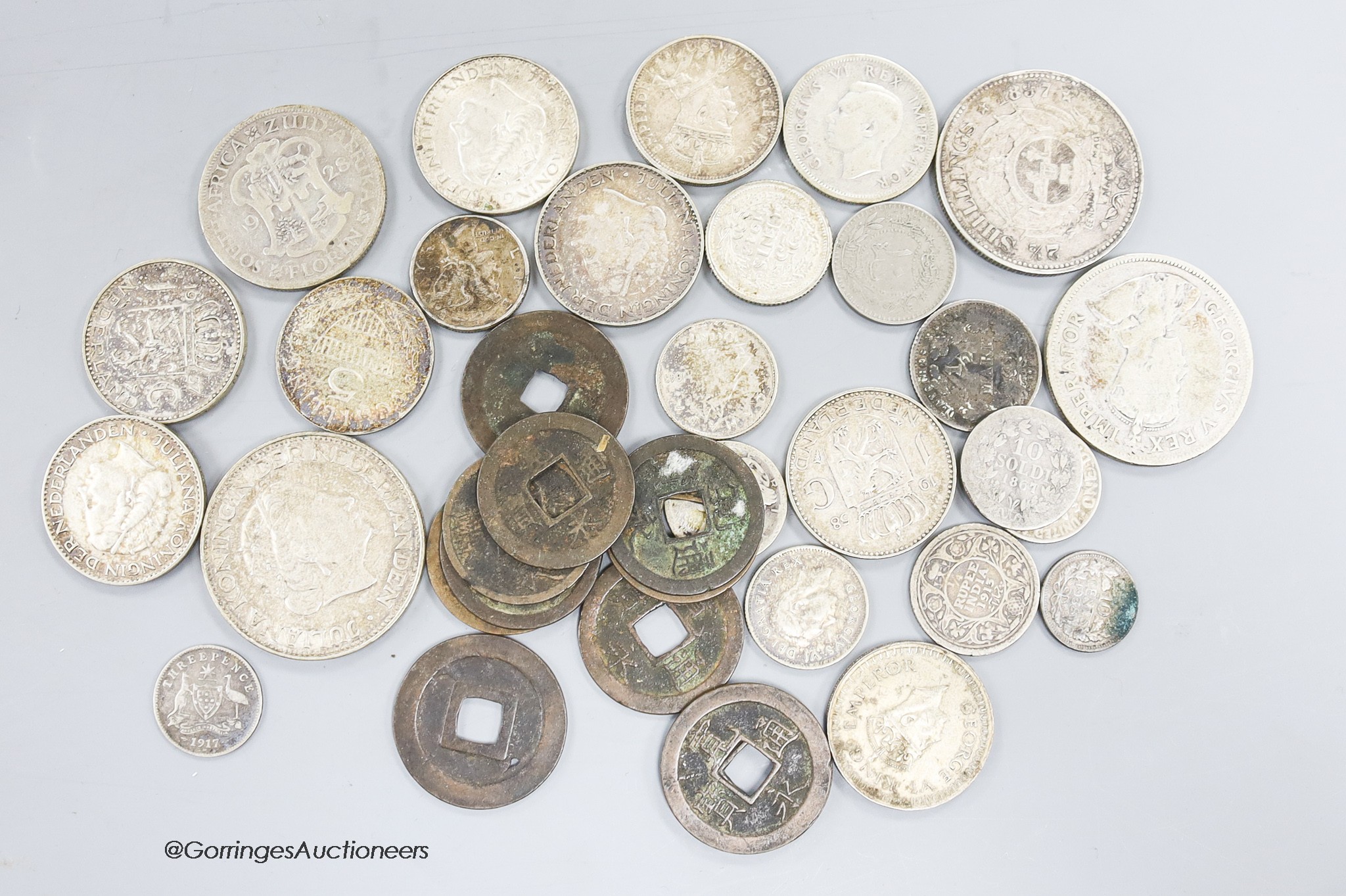 A quantity of assorted coins, including China, South Africa and Europe